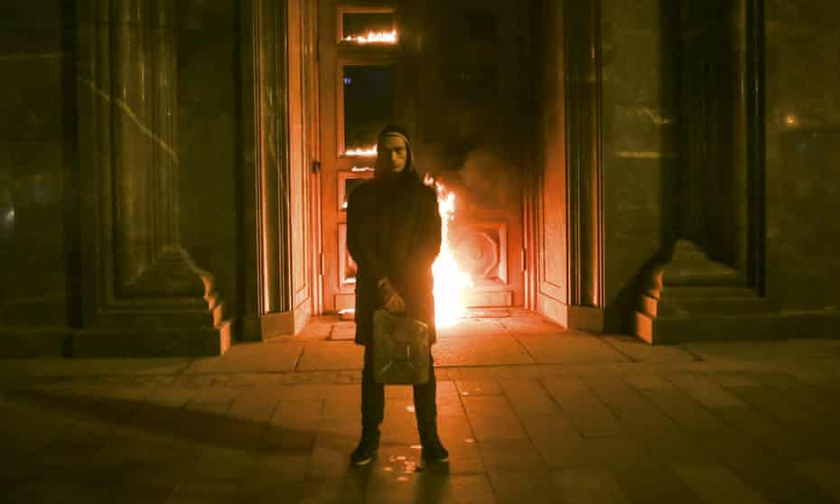 Artist Pyotr Pavlensky holding a petrol  can in front of FSB headquarters in Moscow