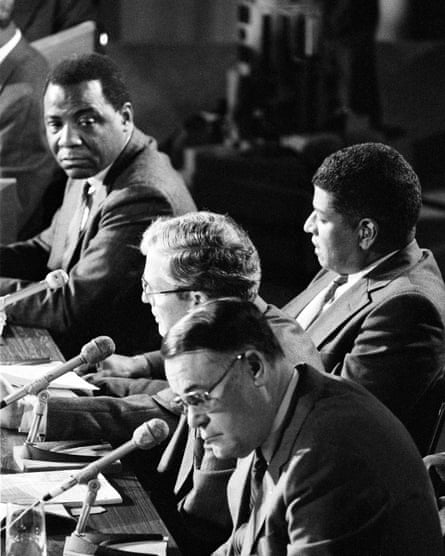 Philadelphia Mayor Wilson Goode, upper left, listens to Fire Commissioner William Richmond answer a question during a session of the special commission investigating the MOVE bombing and fire, Nov. 7, 1985. Behind Richmond is former Managing Director Leo Brooks and in the foreground is Police Commissioner Gregore Sambor.