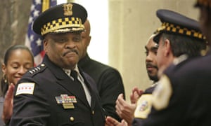 Chicago’s police superintendent, Eddie Johnson, left, shakes hands with other officers at a city council meeting. The department engages in excessive force, according to a justice department investigation.