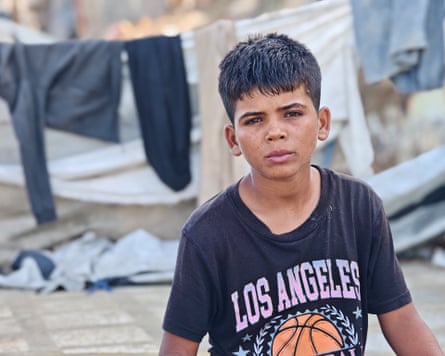 Ramadan Ghaban, 12, near the tent where he lives in Gaza.