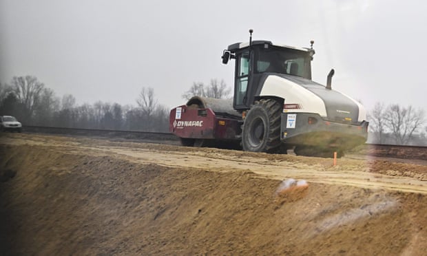 A construction vehicle prepares the ground before the installation of the Budapest-Belgrade railway line, a project of the belt and road initiative, connecting the Greek port of Piraeus with eastern Europe. Photograph: Attila Kisbenedek/AFP/Getty Images A construction vehicle prepares the ground before the installation of the Budapest-Belgrade railway line, a project of the belt and road initiative, connecting the Greek port of Piraeus with eastern Europe. Photograph: Attila Kisbenedek/AFP/Getty Images