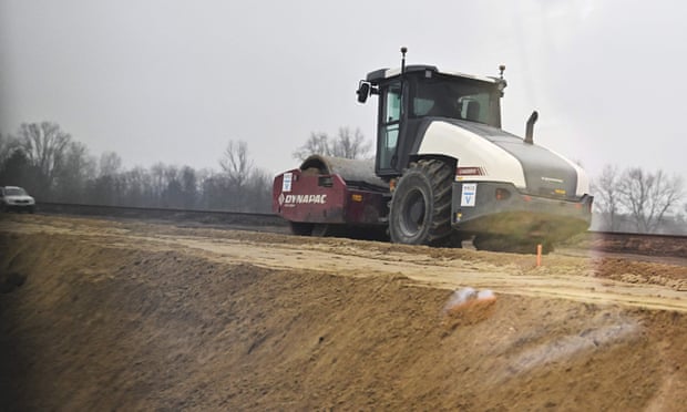 A construction vehicle prepares the ground before the installation of the Budapest-Belgrade railway line, a project of the belt and road initiative, connecting the Greek port of Piraeus with eastern Europe. Photograph: Attila Kisbenedek/AFP/Getty Images