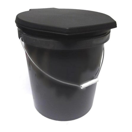 A black travel toiled with swing handle.