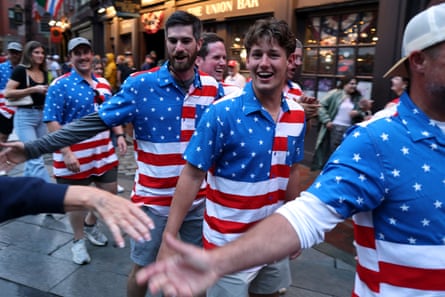 Fans wearing shirts successful nan colours of nan US flag