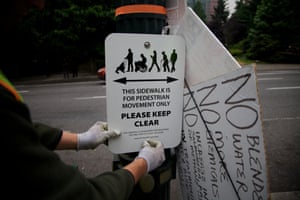 People from Portland Habilitation Center replace signs around Portland, Oregon.