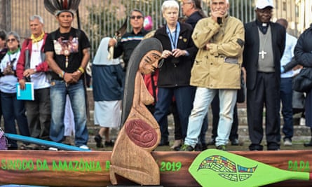 A wooden statuette of a pregnant woman during a procession of indigenous leaders at the Rome synod