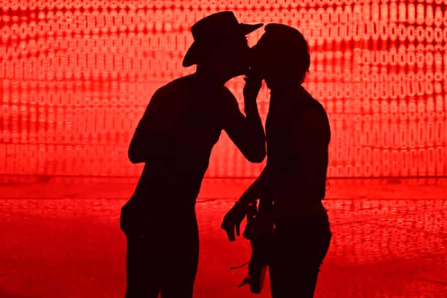 Singer Achille Lauro (L) kisses his guitarist as he performs on behalf of San Marino.