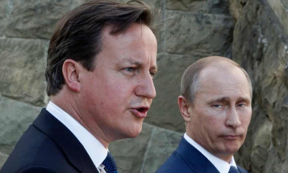 Vladimir Putin, right, and David Cameron speak to the media in the Black Sea resort of Sochi, Russia.