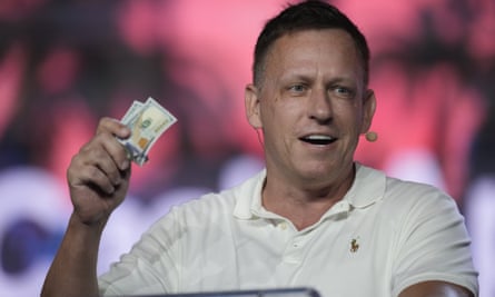 Peter Thiel, holding some dollar banknotes, gives a speech