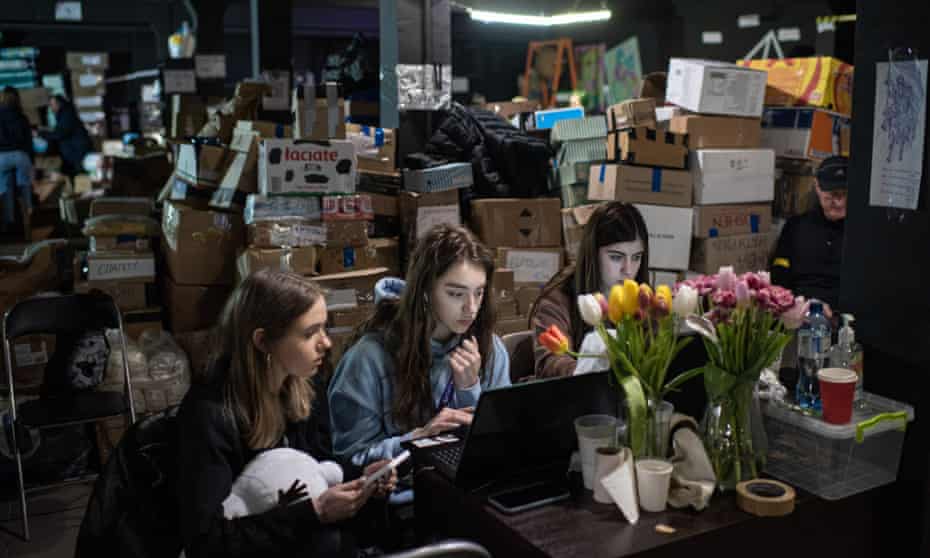 Volunteers on a laptop in Ternopil, Ukraine, arrange supplies for internally displaced persons across the country.