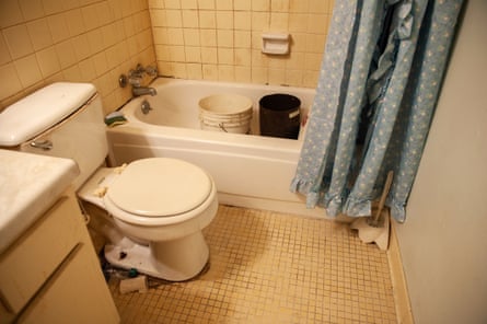 Buckets of water used for flushing the toilet in a resident’s bathtub in Jackson, Mississippi, on 2 March.