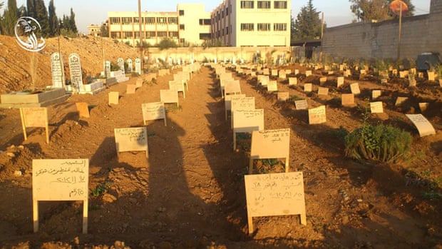 Mass graves dug in the land behind Abu Suleiman al-Darani mosque to bury those who were killed in the Daraya massacre.