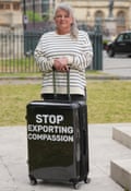 Louise Shackleton with suitcase with message ‘stop exporting compassion’