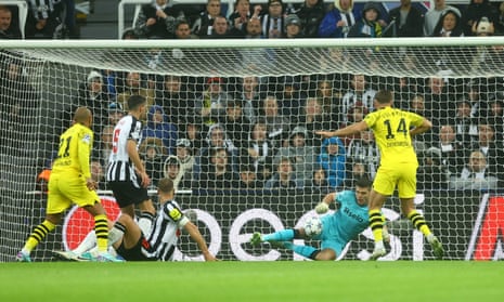Borussia Dortmund's Niclas Fullkrug has his shot saved by Newcastle United's keeper Nick Pope.