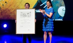 The Australian child book illustrator Shaun Tan (L) holds up The Astrid Lindgren Memorial Award after receiving from Swedish Crown Princess Victoria (R) during a ceremony at the Stockholm Concert Hall in Sweden, May 31, 2011. PHOTO FREDRIK SANDBERG / SCANPIX SWEDEN ** SWEDEN OUT ** (Photo credit should read FREDRIK SANDBERG/AFP/Getty Images)