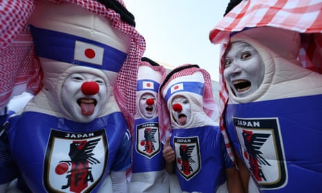 A group of Japanese fans in fancy dress at a World Cup game