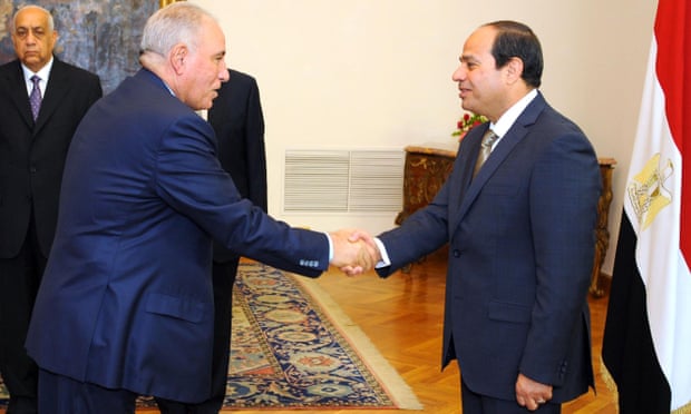 Egyptian president Abdel Fattah al-Sisi (right) shaking hands with Egypt’s justice minister Ahmed al-Zind, who lost his job after saying he would imprison anyone, ‘even a prophet’.
