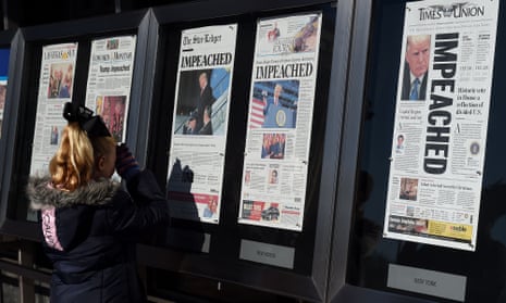 Newspaper front pages on display at the Newseum in Washington DC on 19 December 2019.