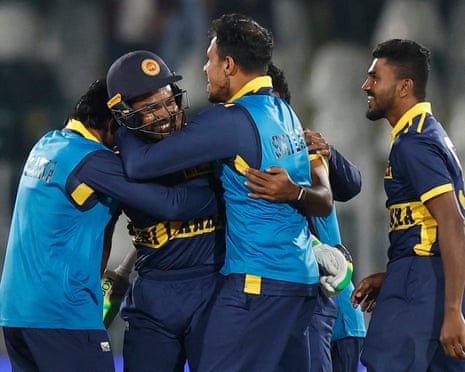 Sri Lanka's Janith Liyanage celebrates with teammates after his match-winning six