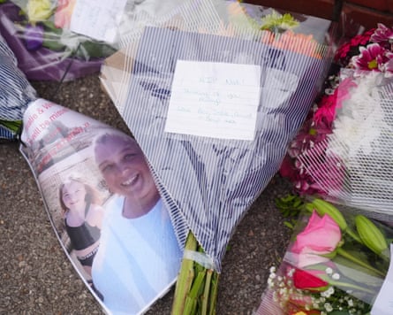 Floral tributes including a photo of Natalie and Valentina, and a handwritten note to “Nat”
