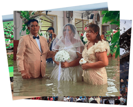 A Filipino bride walks the aisle of St John the Baptist Parish in floodwaters at Hagonoy, Bulacan