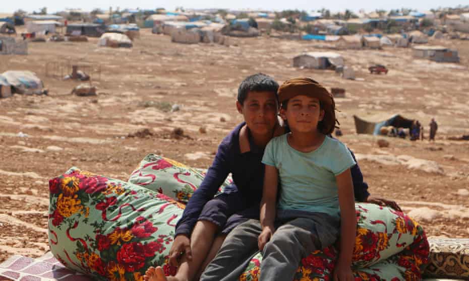 Boys who fled from Idlib in a camp near the Syrian border with Turkey