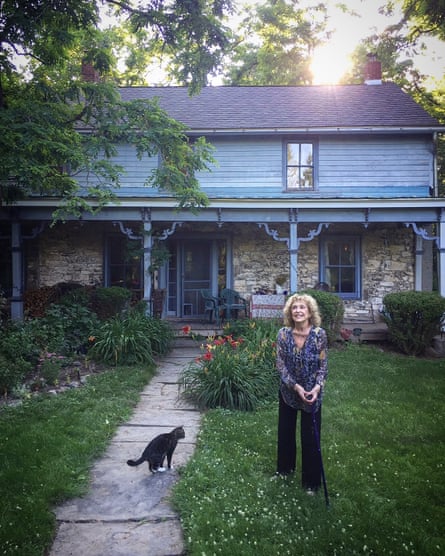 Carolee Schneemann and one of her cats outside her home in 2017.