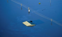 Only a roof is visible in flood waters at Windsor and Pitt Town, along the Hawkesbury River on Sydney's outskirts