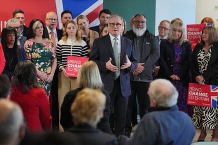 Keir Starmer, speaking at a distribution centre for Peak Pharmacy in front of people holding ‘Bring change to Britain’ signs in Chesterfield, Derbyshire