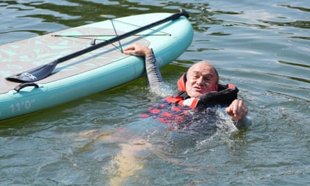 Ed Davey falls off a paddleboard during his visit to Streatley, Berkshire, 26 June.