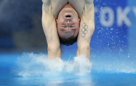 Tom Daley hits the water during a dive in the individual 10m platform event at the Tokyo Olympics