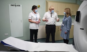 Britain’s Prime Minister Boris Johnson is shown a CT scan room during a visit to Hexham General Hospital.