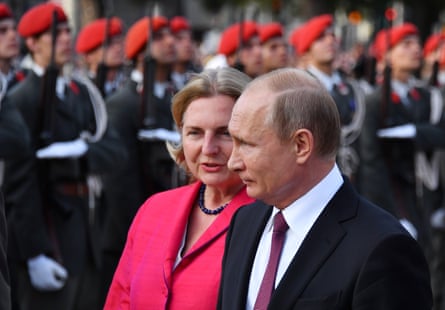 Kneissl and Putin take part in a wreath laying cermony at the Soviet second world war memorial in Vienna, Austria, 5 June 2018.
