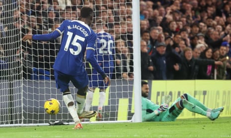 Nicolas Jackson cores as the goalkeeper is seen on the wrong side of the post