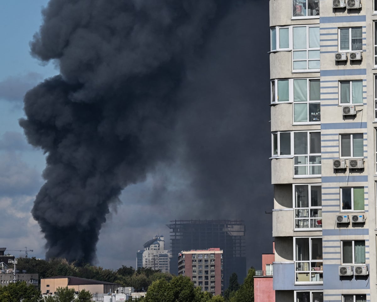 Smoke rises above the city following an air attack in Kyiv.