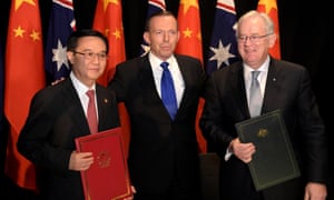 CANBERRA, AUSTRALIA - JUNE 17: (L-R) Chinese Minister of Commerce Dr Gao Hucheng, Australian Prime Minister Tony Abbott and Australian Minister for Trade Andrew Robb pose for a photograph after signing the Free Trade Agreement (FTA) between the two countries on June 17, 2015 in Canberra, Australia. Hucheng is in Australia to formalise the free trade agreement between Australia and China. (Photo by Lukas Coch - Pool/Getty Images)