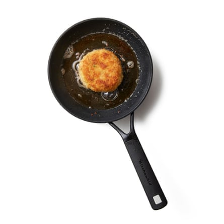 Put the butter and oil in a skillet over medium-high heat, and once it's hot and the foam has subsided, put the fish cakes in batches if the skillet is small, and cook for about five minutes, until golden and flaky well underneath. Carefully flip it over, repeat on the other side, and then eat right away.