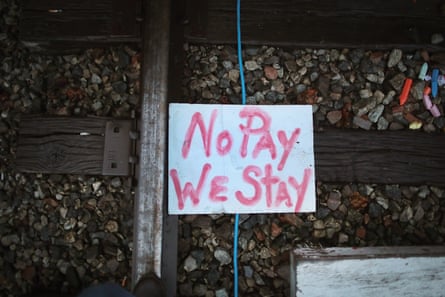 A sign sits on the railroad tracks where unemployed Blackjewel coal miners are manning a blockade of the rail line that leads to their old mine in Cumberland, Kentucky.