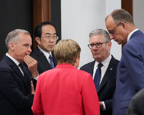 Managing Director of the International Monetary Fund (IMF) Kristalina Georgieva, British prime minister Keir Starmer, Canadian prime minister Mark Carney and German chancellor Friedrich Merz talk as they arrive for a working session with G7 leaders and partners on promoting economic growth, during the G7 Summit in Evian-les-Bains, France.