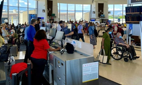 Passengers wait inside a terminal at Washington Reagan national airport.