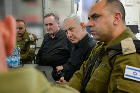 Israeli prime minister Benjamin Netanyahu and Israeli defence minister Israel Katz speak to soldiers.