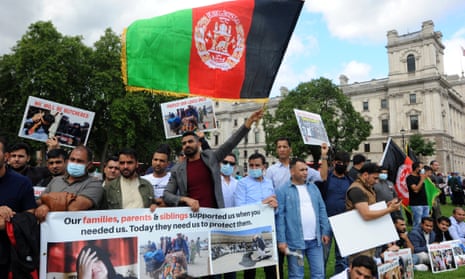 Protesters in Parliament Square, London, call on the UK government to protect Afghan people