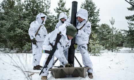 Ukrainian border guards practice firing a 120 mm mortar near the border with Belarus in Chernihiv, Ukraine, on February 10, 2024.