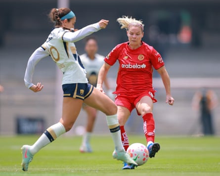 Toluca’s Eugenie Le Sommer (right) battles for possession with Pumas’ Cristina Torres