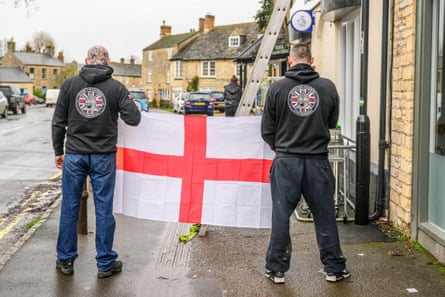 Raise the Colours members putting flags up around Oxfordshire.