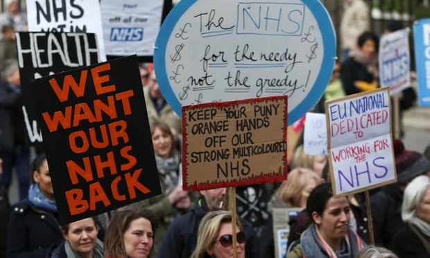Protesters march through central London to demand more funding for the NHS.
