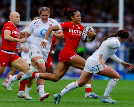 Canada's Asia Hogan-Rochester runs with the rugby ball against England