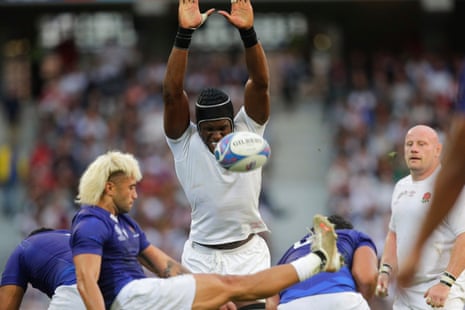 England's Maro Itoje tries to block a kick by Samoa’s Jonathan Taumateine.