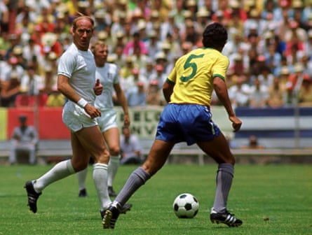 England’s Bobby Charlton surges forward as Brazil’s Clodoaldo looks on.