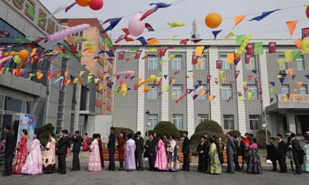 People line up to vote at a polling station in Pyongyang.
